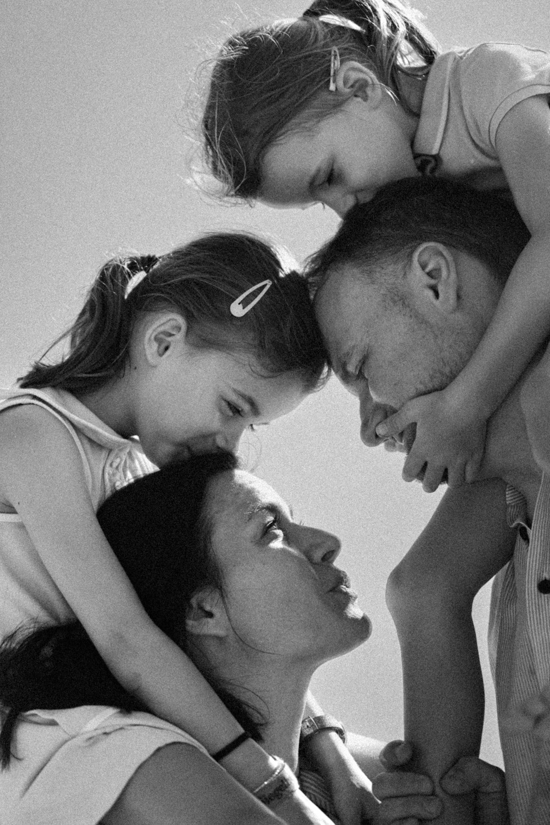 Photo by Hoi An and Da Nang Photographer Family shares a tender moment together outdoors